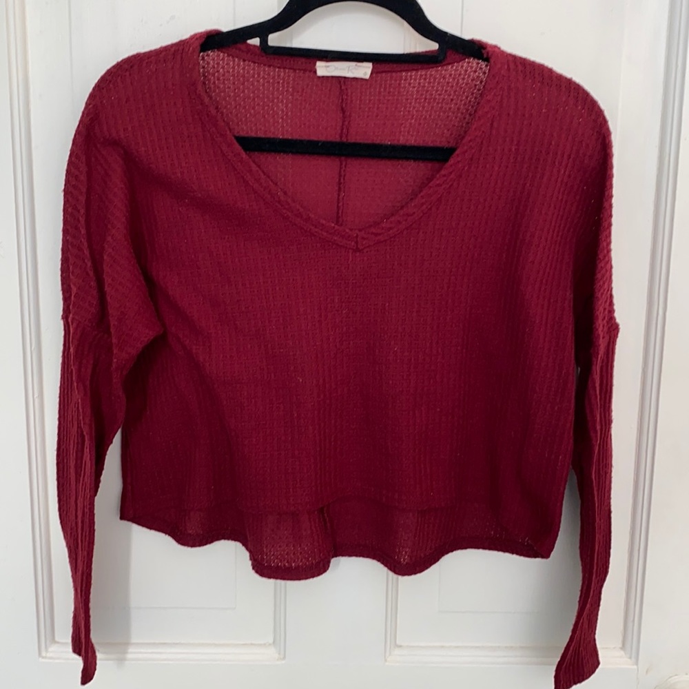 Not a fan or burgundy by Olivia Rae long sleeve cropped shirt back is longer